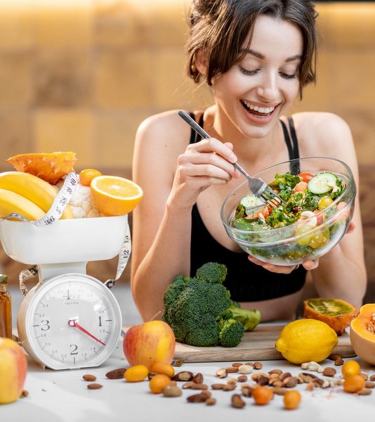 Woman Eating Healthy Diet Food and So Many Diet Nuts, Fruits, Vegetables Around Her